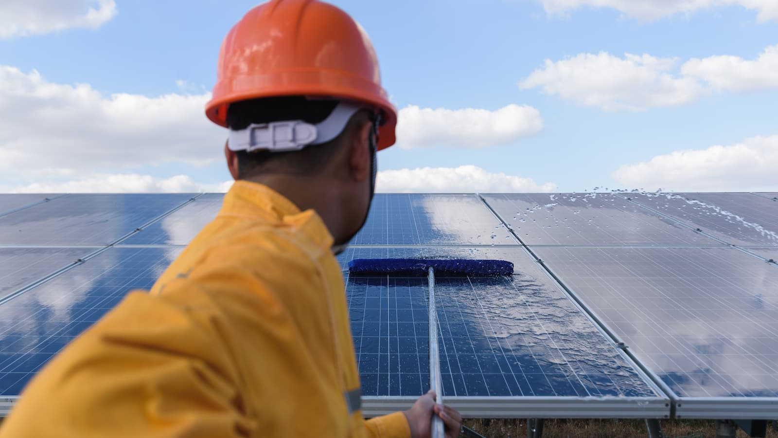 Workman Cleaning Solar Panels